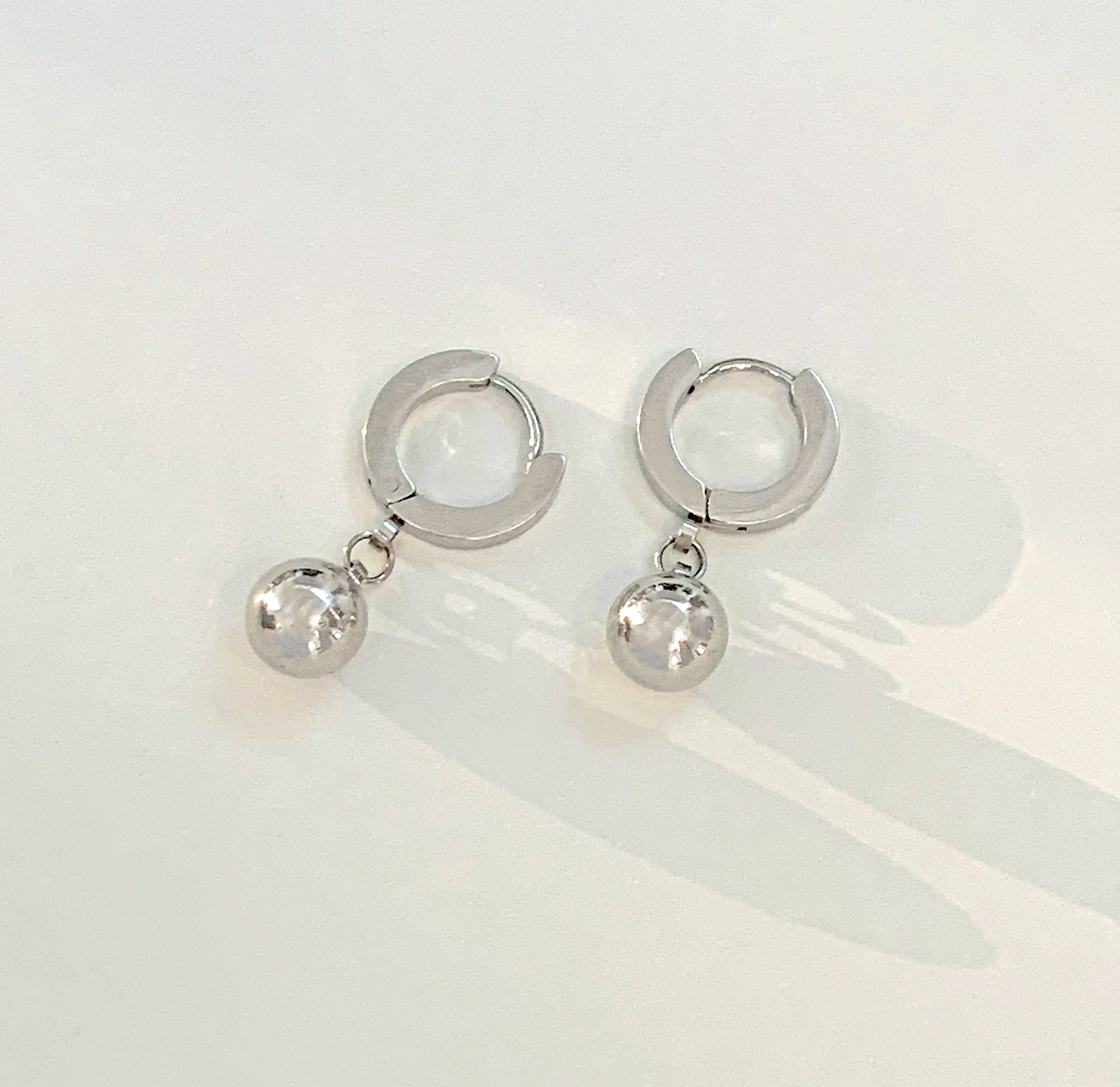 ELLIE SILVER BALL DROP HUGGIE EARRINGS